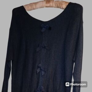 Elle size medium long navy sweater tunic with bow details on back.
